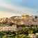 The Acropolis hilltop with the Parthenon temple surrounded by ancient ruins and vegetation